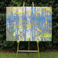 original oil painting by Nicole Athena of cypress trees in swamp with reflections on water displayed on easel