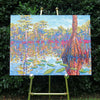 original oil painting by Nicole Athena of cypress trees in swamp with reflections on water displayed on easel