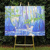 original oil painting by Nicole Athena of cypress trees in swamp with reflections on water displayed on easel